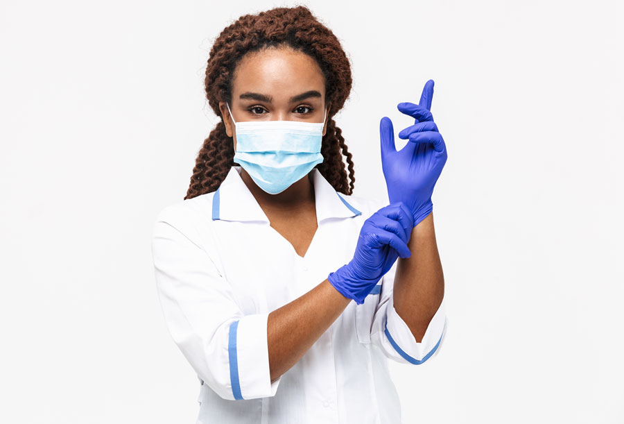 Harvard research shows minorities are more likely to report inadequate PPE and to work with COVID-positive patients. Photo credit Shutterstock licensed.