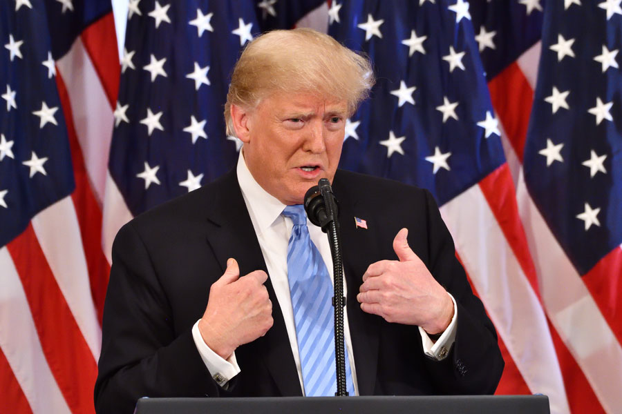 President of the United States Donald J. Trump gestures as he addresses a press conference at the Lotte Palace Hotel. New York, NY,  September 26, 2018. Editorial credit: Evan El-Amin / Shutterstock.com, licensed.