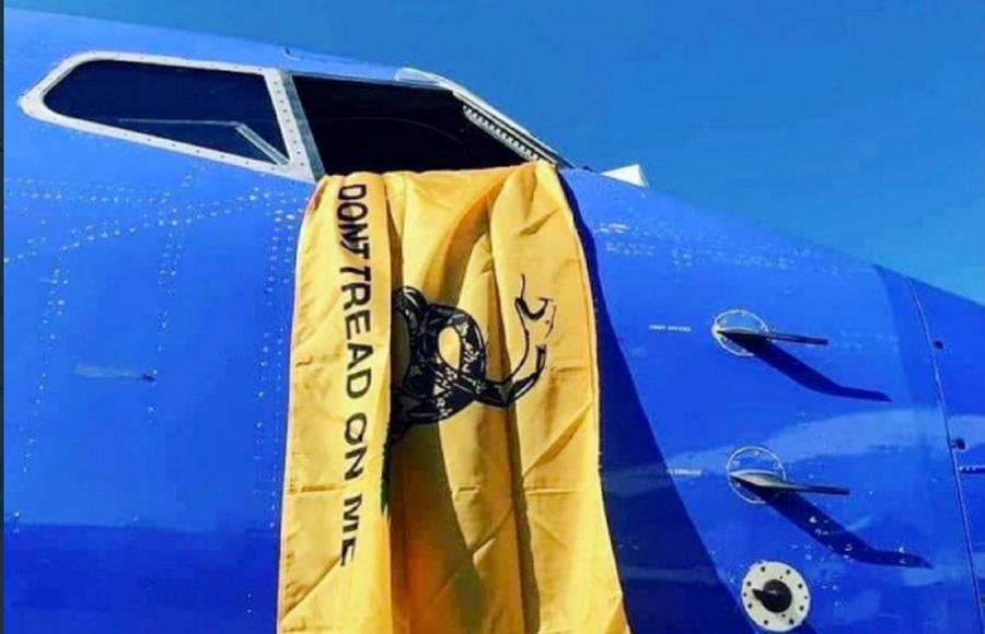 A photo sent into and shared by political columnist Benny Johnson said to be of a grounded Southwest plane flying a Gadsden flag out of the cockpit on Monday Oct 11, 2021. Southwest Airlines officially blamed issues on unspecified weather and Air Traffic Controller issues at Bradley Airport.