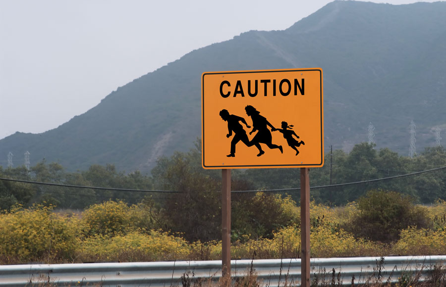Highway Sign Showing Family Crossing
