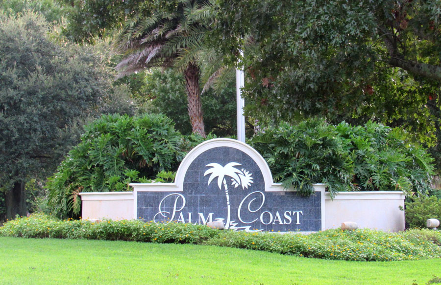 A welcoming sign to those entering the vicinity of Palm Coast, Florida. 