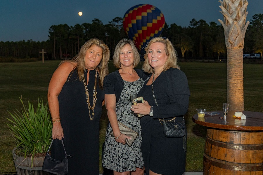 From left, Berkshire Hathaway HomeServices Florida Network Realty’s Laura Kelly, Tracy Glochau and Amy Alloways at Balloon Glow Gala.

