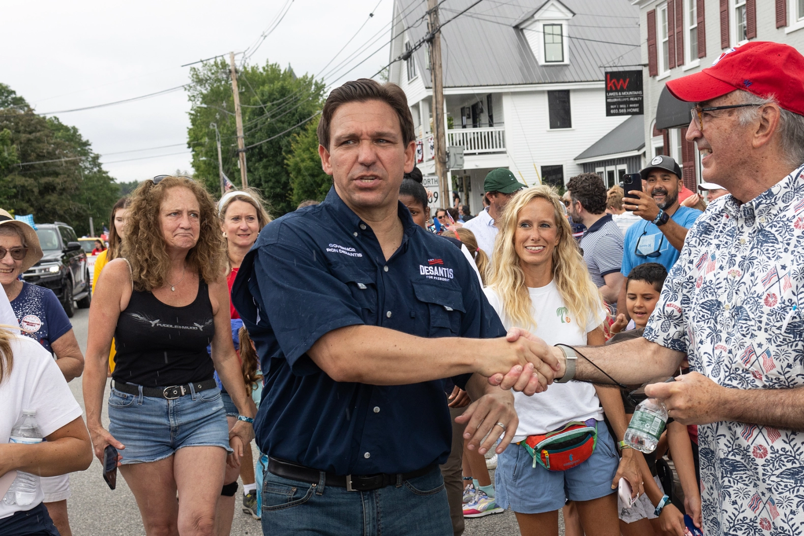 Republican presidential candidate, Florida Governor Ron DeSantis, joined by his wife Casey and their children, greets residents at a Fourth of July parade on July 4, 2023, in Wolfeboro, New Hampshire. DeSantis is trying to make up ground on former President Donald Trump, who is currently the clear Republican front-runner. 